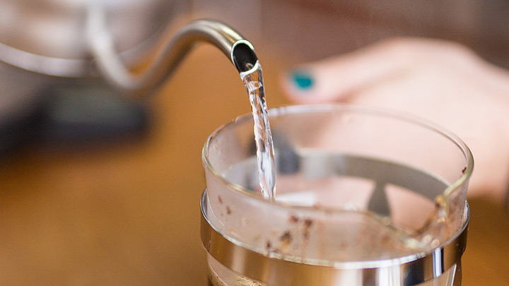 Add more water until full. The ideal french press coffee ratio is 1:15 parts coffee to water.